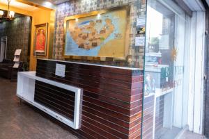 a map on a brick wall in a store window at StayGuru Park View Residency in Bhuj
