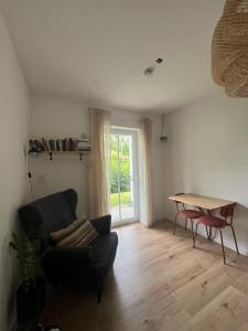 a living room with a couch and a table at Schöne Wohnung in Passau in Passau