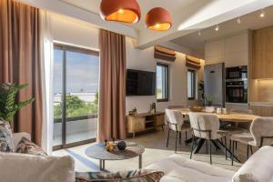 a living room with a table and a dining room at Ark Luxury Suite, Hot tub & Sea Views, by ZanteWize in Tragaki
