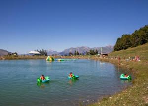 a group of people in kayaks in the water at Bel appartement montagne in Albiez-Montrond