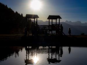 a group of people on a playground by a body of water at Bel appartement montagne in Albiez-Montrond +2 photos