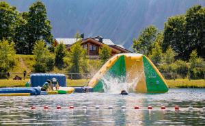 a person is playing in a water park at Bel appartement montagne in Albiez-Montrond