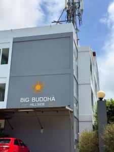 a large sign on the side of a building at Big Buddha Hillside Hotel in Phuket