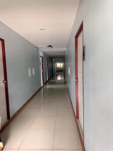 an empty hallway in a building with a long corridor at Big Buddha Hillside Hotel in Phuket