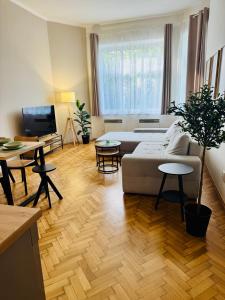 a living room with a couch and a table at City Apartment 920 in Pardubice