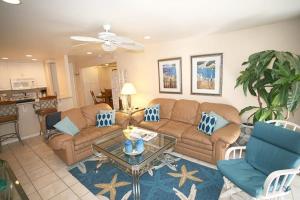 a living room with two couches and a table at A209 - Sandy Paradise - On-the-Sand in Oceanside