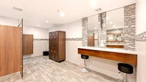 a bathroom with a sink and a mirror at A209 - Sandy Paradise - On-the-Sand in Oceanside +50 photos
