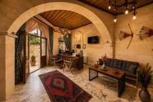 a living room with a couch and a table at Premium Cappadocia in Göreme