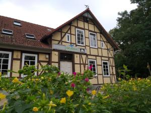 a building with a bunch of flowers in front of it at Cafe-Kuckuck in Salzwedel
