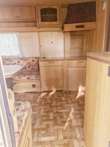a kitchen with a dog laying on the floor at Hacienda Caravan in Szentes