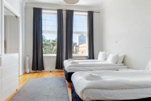 a room with three beds and a window at Best Western Hotel at 108 in Stockholm +48 photos