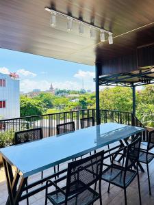 a large blue table and chairs on a balcony at MoChy Homestay in Thôn Trường Giang
