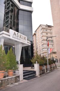 a building with a sign for a train business at Asrin Business Hotel Kızılay in Ankara