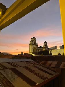 a view from the roof of a building at sunset at Plaza Central Boutique House in Cochabamba