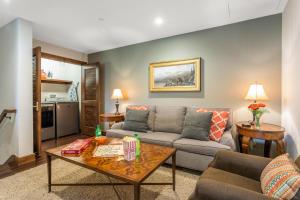 a living room with a couch and a table at 406 The Ascent in Avon