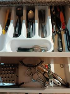 a drawer filled with lots of kitchen utensils at Sanctuary 4 in Tauranga
