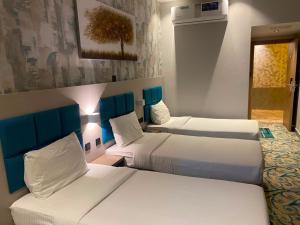 a hotel room with two beds in a room at TAMARIND HOTEL in Dubai +59 photos