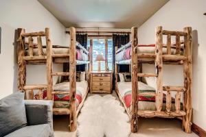 a bedroom with two bunk beds and a couch at 205 Bear Paw Lodge in Avon +50 photos