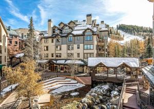 a large building with a snow covered roof at 323 Beaver Creek Lodge in Avon