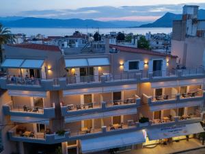 a view of a building with a balcony at TRIANTAFYLLOY ROOMS in Loutra Edipsou