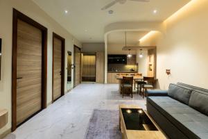 a living room with a couch and a table at Justa Natures Nest Resort in Bullāwāla