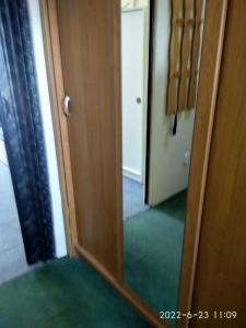 an open door with a mirror in a room at Mary in Cheb