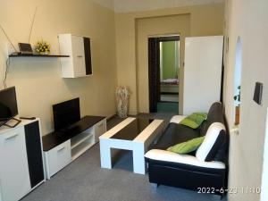a living room with a couch and a table at Mary in Cheb