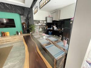 a view of a kitchen with a table and a counter at V house 1 in Ban Huai Yai