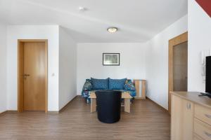 a living room with a couch and a table at Apartment 44 in Bad Dürrheim