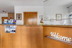 a melbourne hospital reception counter with a welcome sign at Apartment 47 in Bad Dürrheim