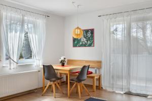 a dining room with a table and chairs at Apartment 47 in Bad Dürrheim