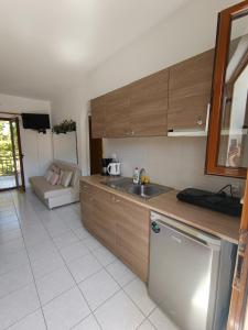 a kitchen with a sink and a counter top at Maria Village in Vourvourou