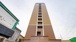 a tall building with a balcony on top of it at Toyoko Inn Kitakami-eki Nishi-guchi in Kitakami +76 photos