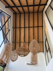 a room with three lights on the wall at Kilimanjaro Haven Villas in Shiri