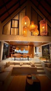 a living room with a couch and a table at Kilimanjaro Haven Villas in Shiri