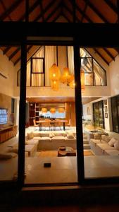 a large living room with couches and a table at Kilimanjaro Haven Villas in Shiri