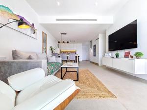 a living room with a couch and a tv at La Llana Beach MDC - 8010 in Mar de Cristal