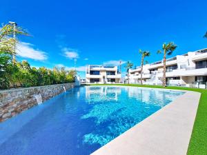 a swimming pool in front of a building at La Llana Beach MDC - 8010 in Mar de Cristal