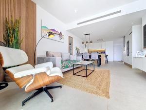 a living room with a couch and a table at La Llana Beach MDC - 8010 in Mar de Cristal