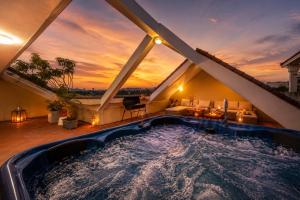 a hot tub in the attic of a house at Spacious 8BR Rooftop Jacuzzi Villa for Groups near West Lake in Hanoi