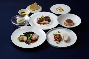 a group of plates of food on a table at Mare Blu Amami in Tatsugo