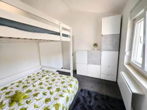 a bedroom with a bunk bed in a room at Seaside Cottage Barbariga in Peroj
