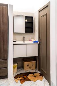 a bathroom with a sink and a mirror at LUNA House in Can Tho