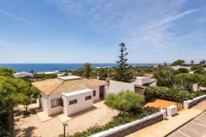 a house with a view of the ocean at Villa Ribes by Escape Home in Binibeca