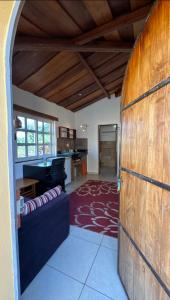 a living room with a wooden door and a couch at Curlt stays in Kampala