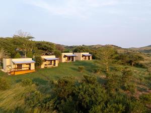 an aerial view of a group of houses on a hill at Sunset Safari Camp at Hluhluwe Game Park in KwaNompondo