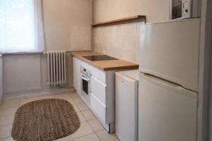 a kitchen with a white refrigerator and a sink at Chambre 3 privée lit double Béthune centre in Béthune