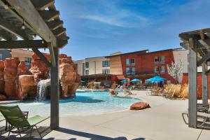 a pool at a resort with a water park at SpringHill Suites by Marriott Moab in Moab