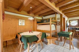 a bedroom with a bed and a table in a room at Bnb Erba Maga in Rabbi