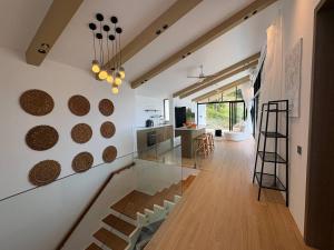 a kitchen with a glass counter and a staircase in a room at Villa 7 Ocean View Pool Villa in Bophut